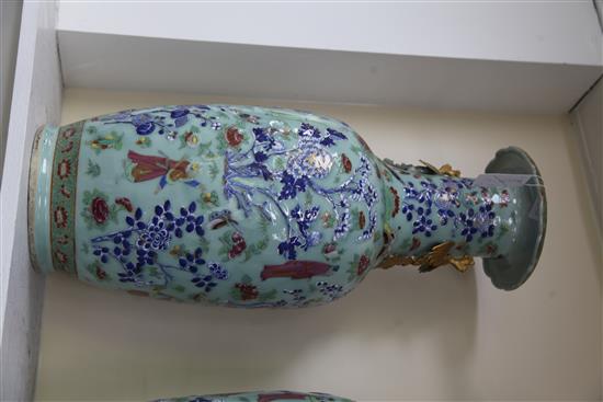 A pair of large Chinese famille rose and underglaze blue celadon ground vases, 19th century, 64cm, restoration to handles